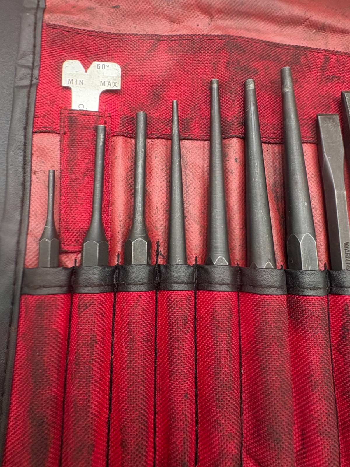 snap on 11pc punch and chisel set in soft roll case (some wear)