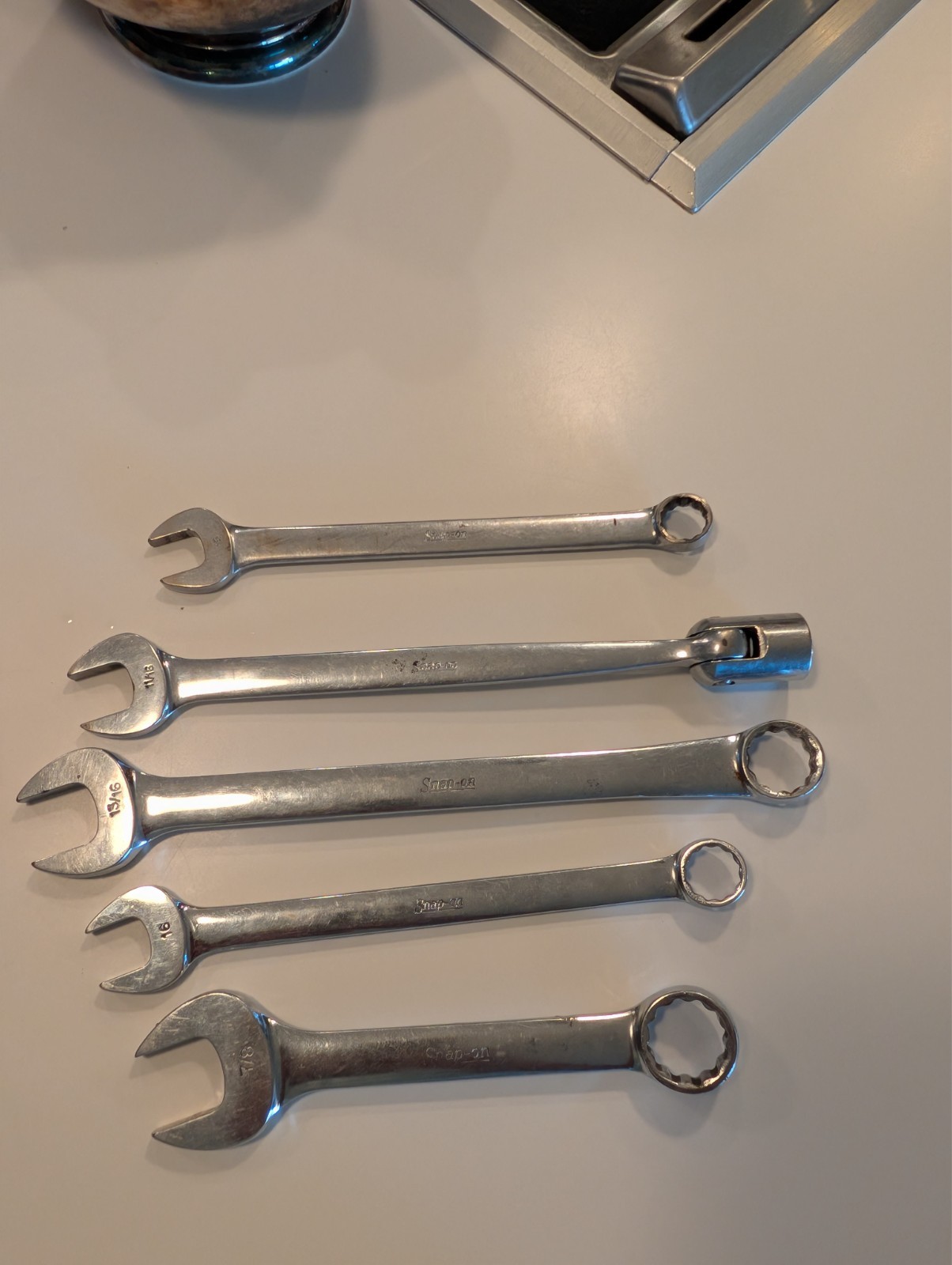 five snap-on wrenches. Four open end one swivel head. Decently well maintained