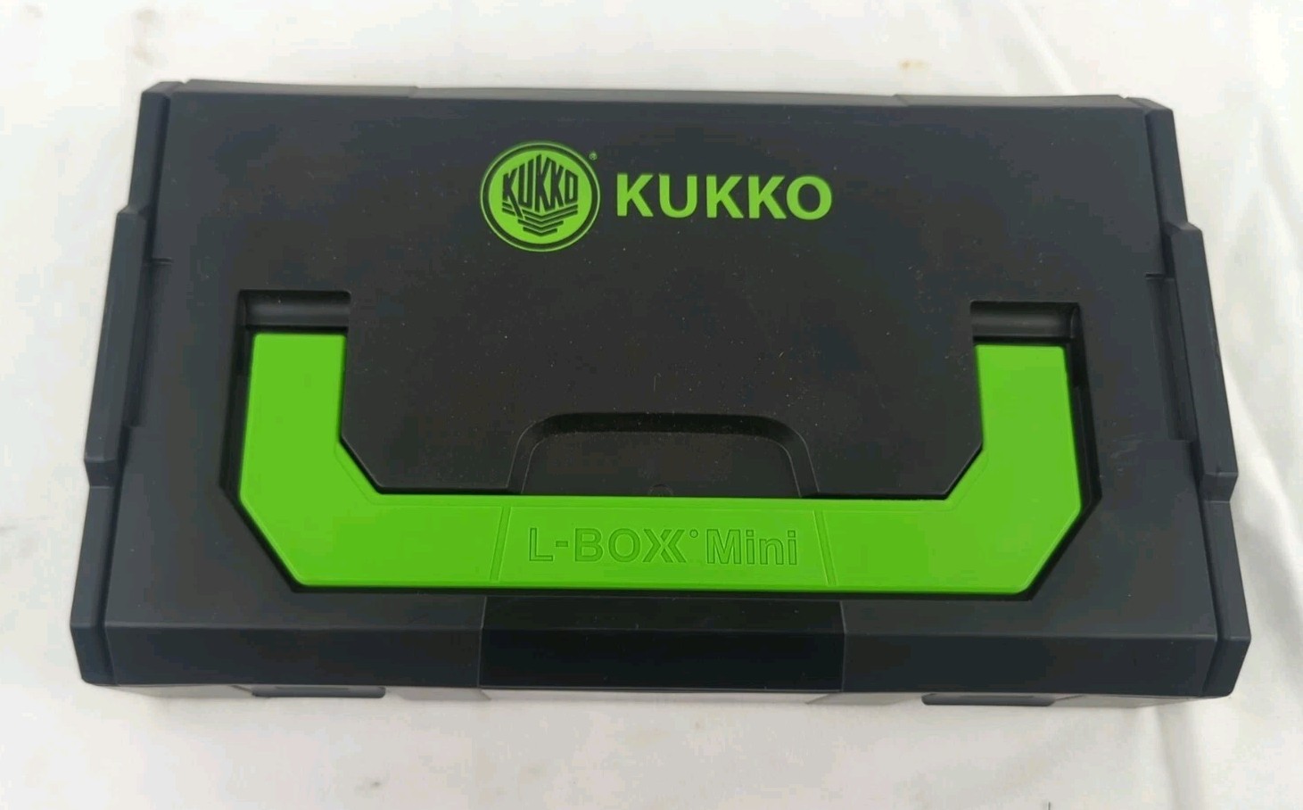 Kukko L Boxx Mini with various connecting nuts adapters bolts washers