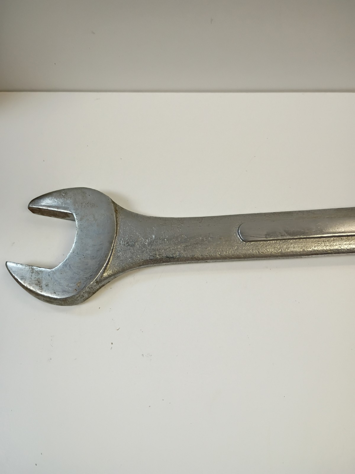 1-3/8-inch combination wrench featuring an open end and a 12-point box end