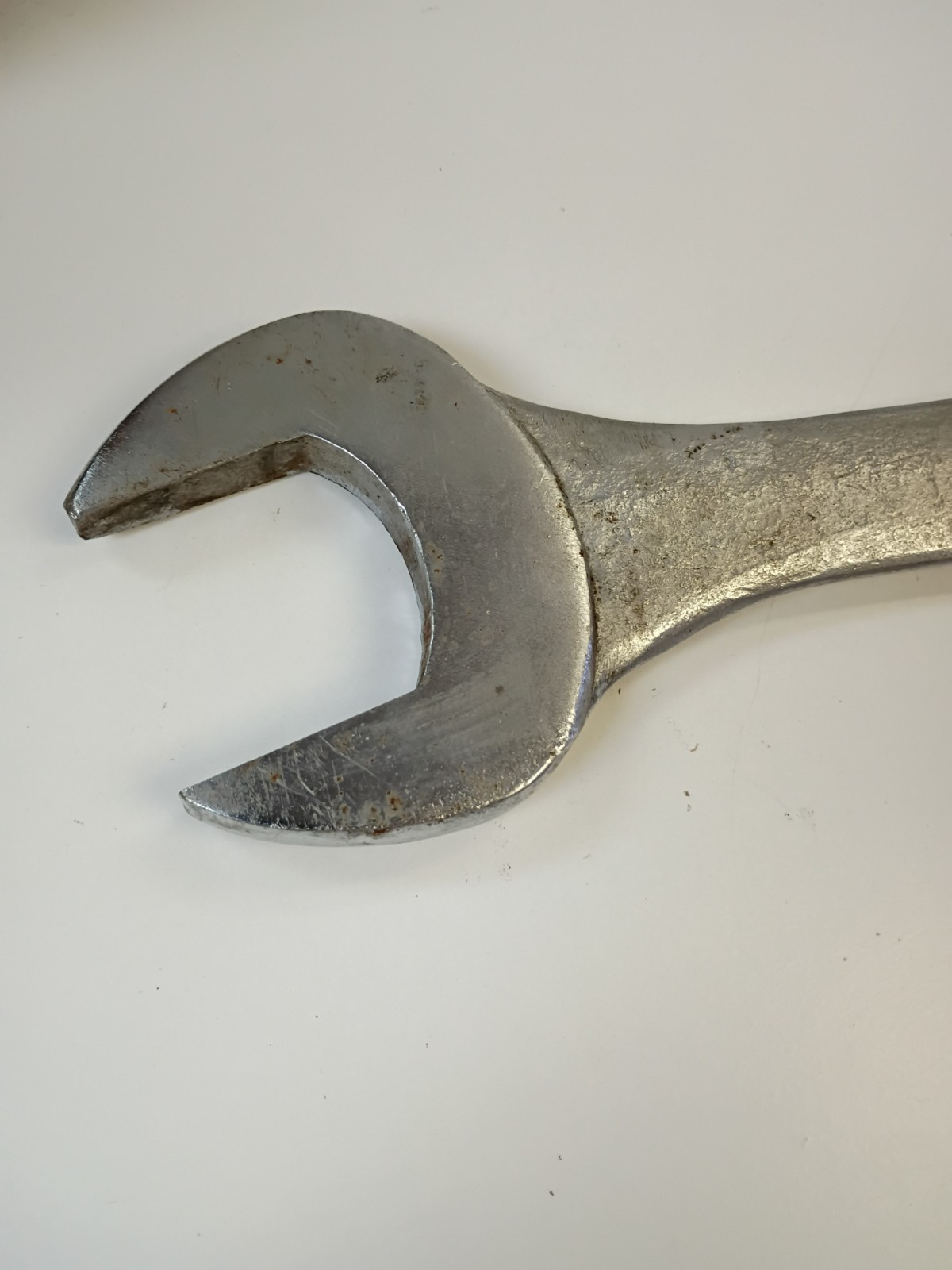 1 -7/8-inch combination wrench featuring an open end and a 12-point box end