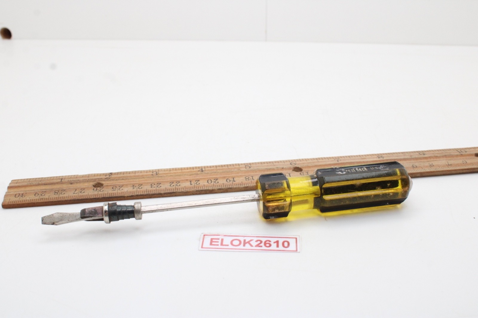 Great Neck Hard Amber/Black Handle Holding Slotted Flat Screwdriver