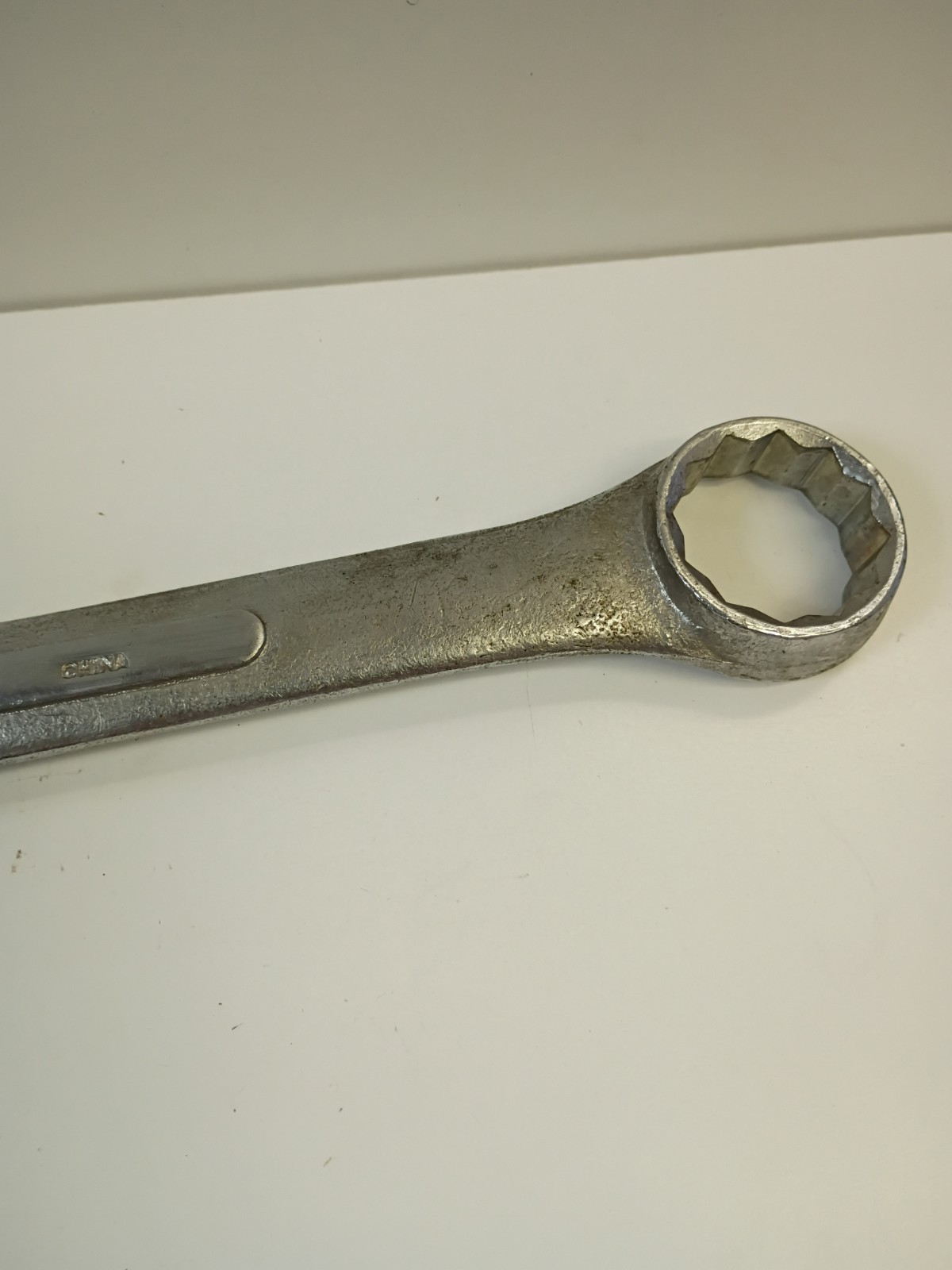 1-3/8-inch combination wrench featuring an open end and a 12-point box end