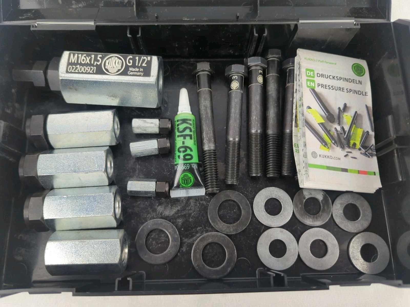 Kukko L Boxx Mini with various connecting nuts adapters bolts washers