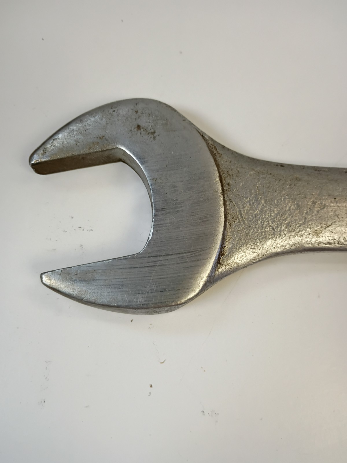 1-3/8-inch combination wrench featuring an open end and a 12-point box end