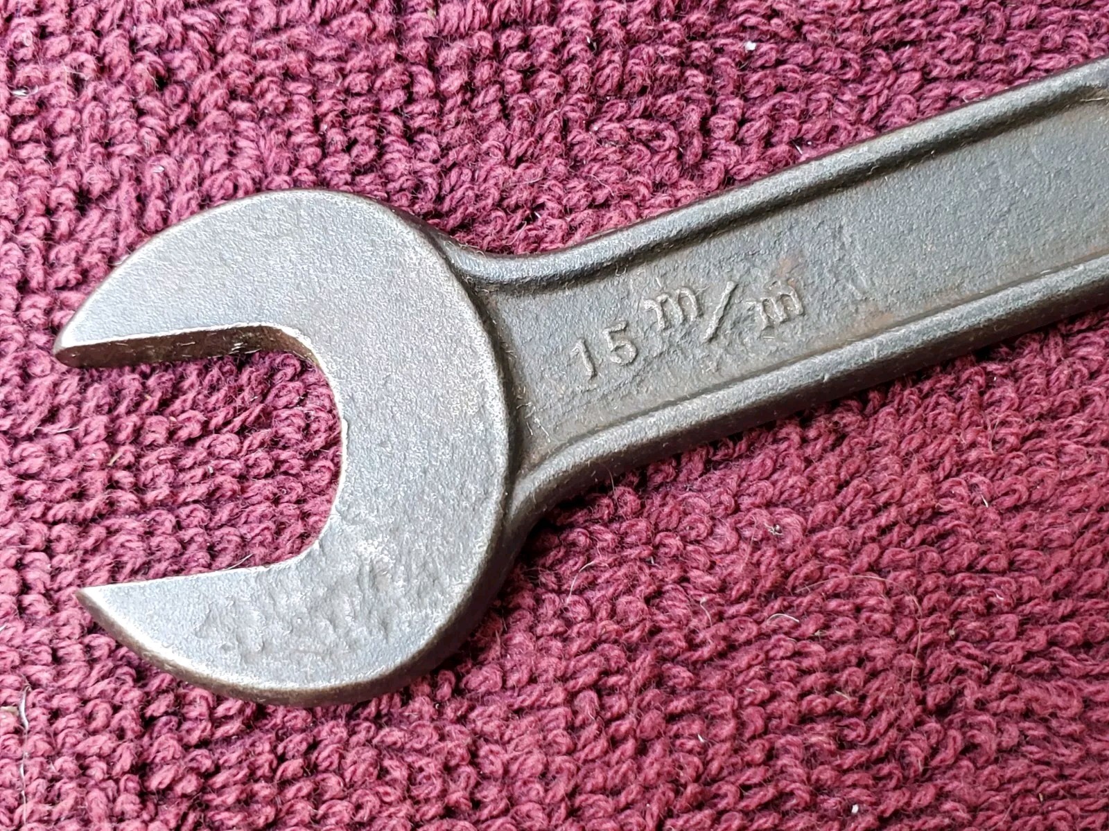 Unmarked 11/16″ by 19/32″ or 15 mm by 18 mm Open End Wrench