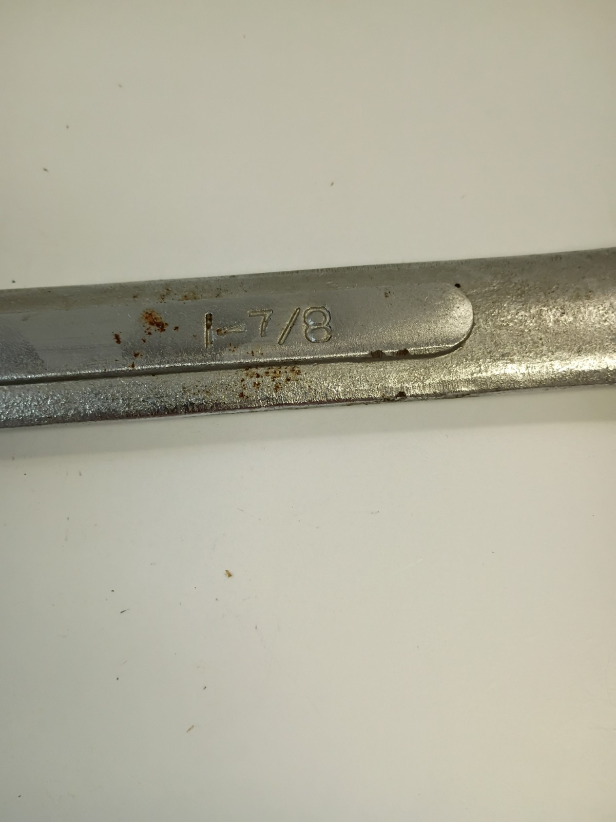 1 -7/8-inch combination wrench featuring an open end and a 12-point box end
