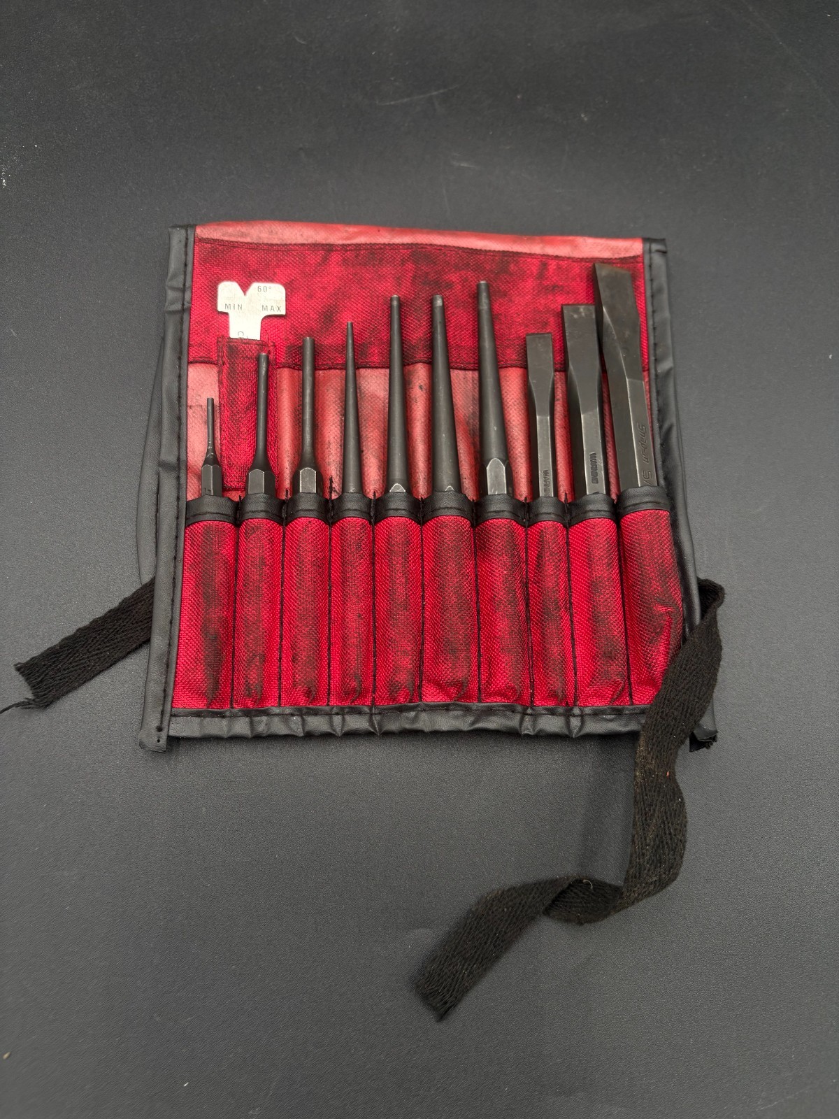 snap on 11pc punch and chisel set in soft roll case (some wear)