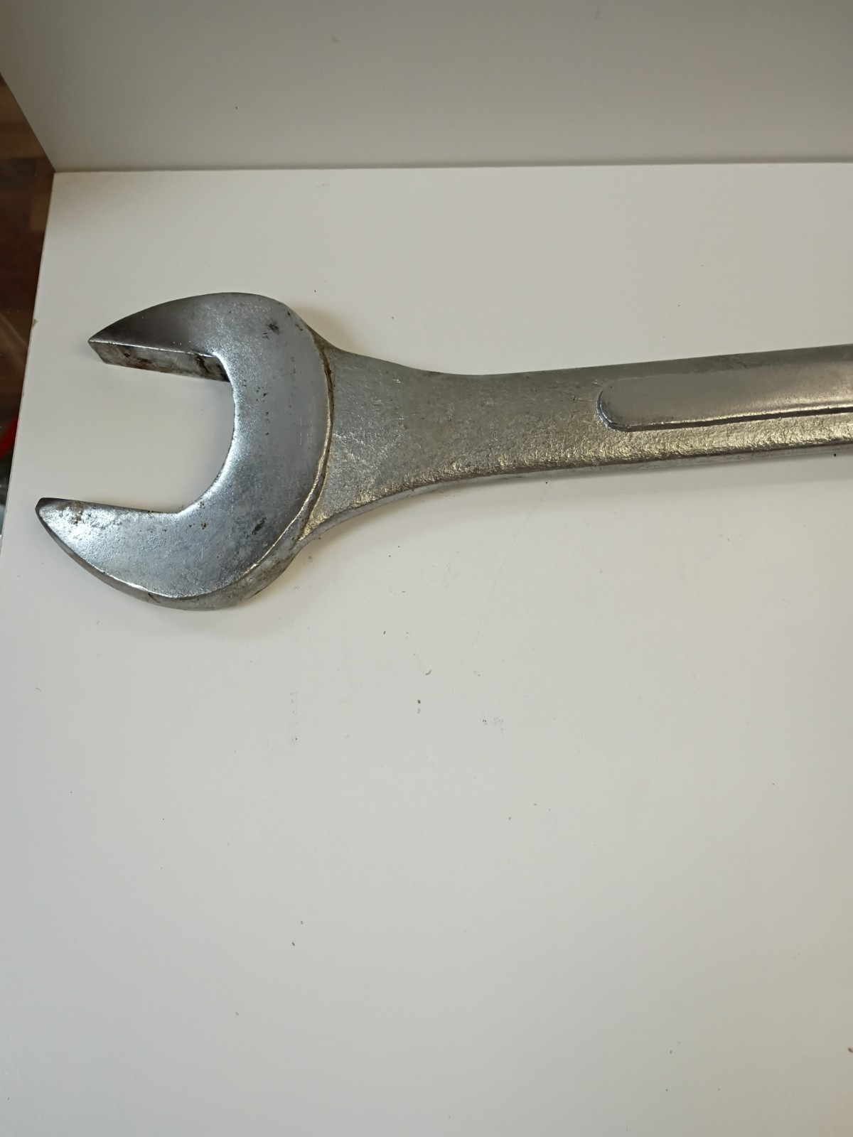 1 -7/8-inch combination wrench featuring an open end and a 12-point box end