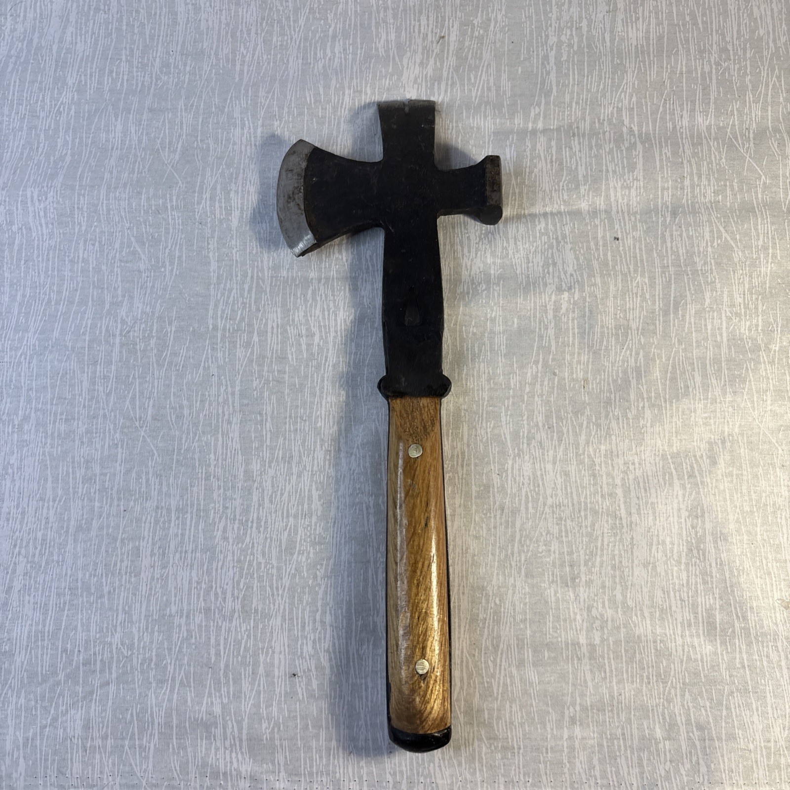 Hammer, Axe, Pry Bar With Black Blade And A Glossy Wooden Handle.