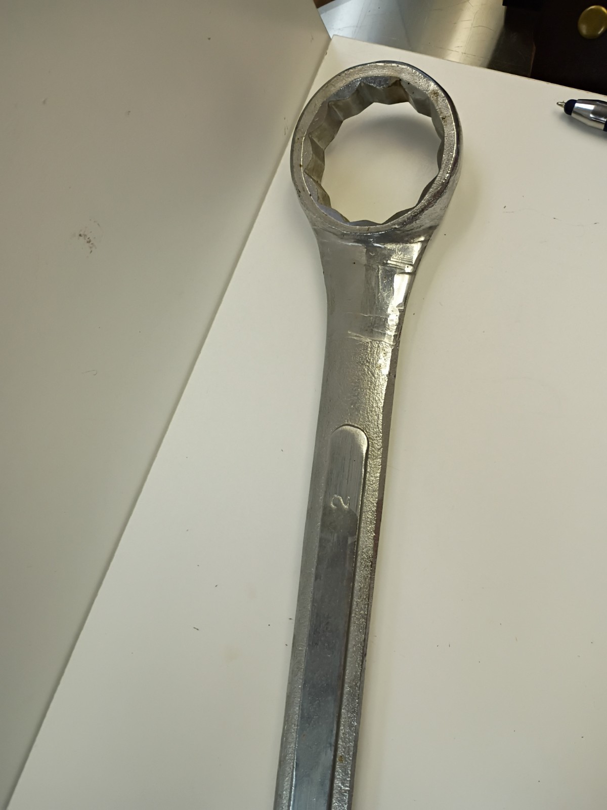 2-inch combination wrench featuring an open end and a 12-point box end