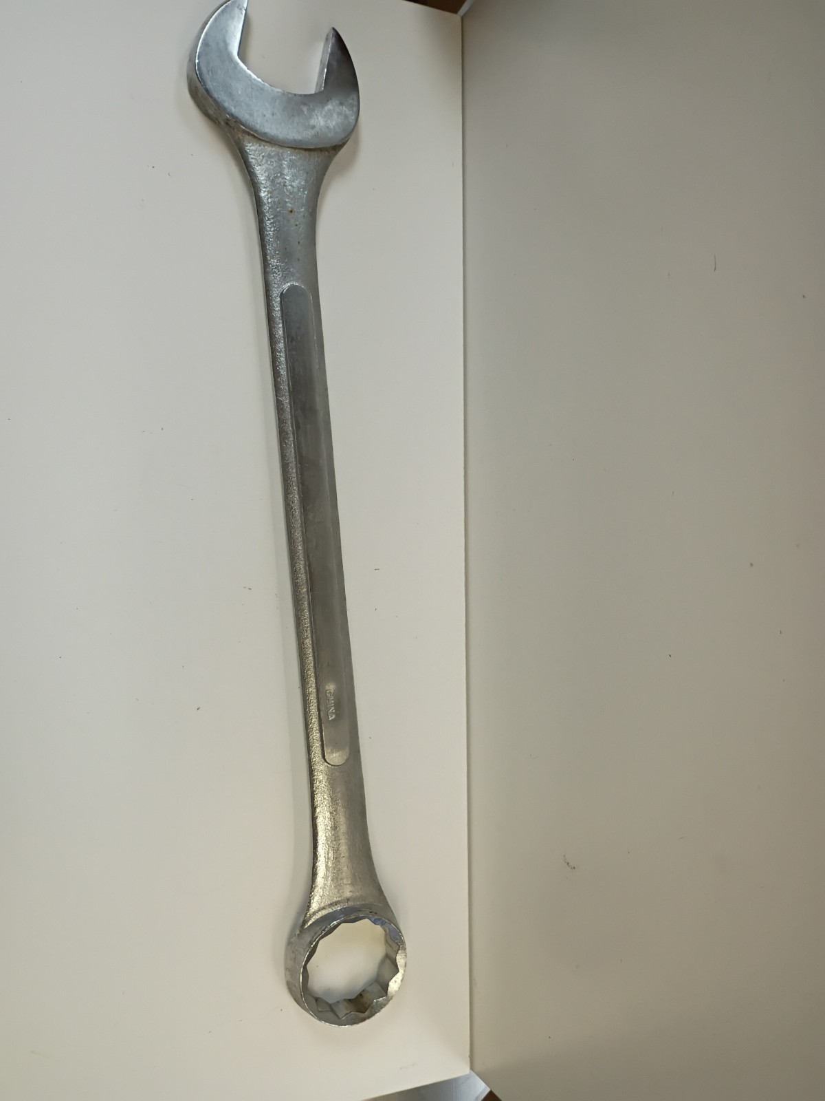 1 3/4-inch combination wrench featuring an open end and a 12-point box end
