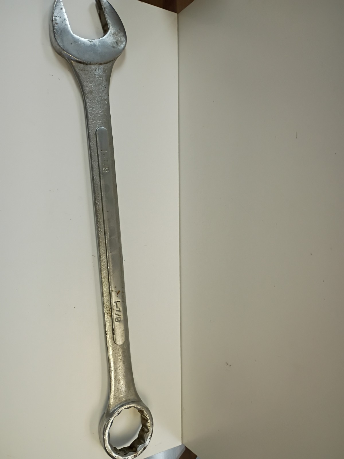 1 -7/8-inch combination wrench featuring an open end and a 12-point box end