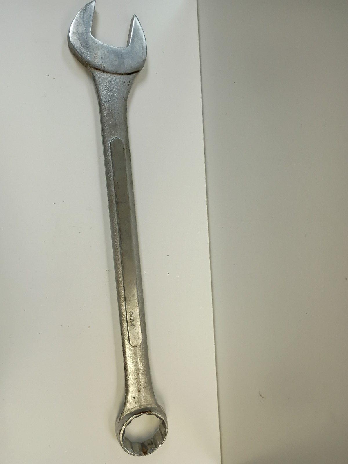 1 5/8-inch combination wrench featuring an open end and a 12-point box end