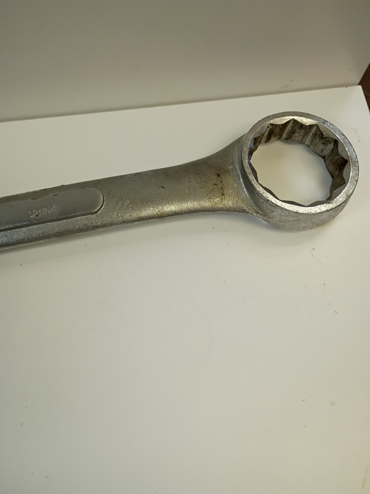 1 -7/8-inch combination wrench featuring an open end and a 12-point box end