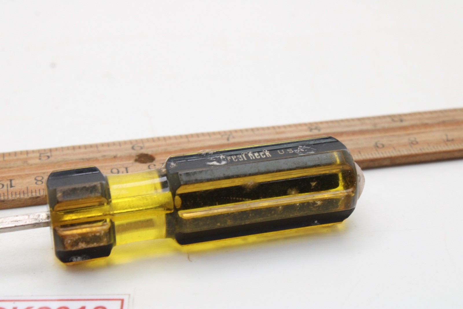 Great Neck Hard Amber/Black Handle Holding Slotted Flat Screwdriver