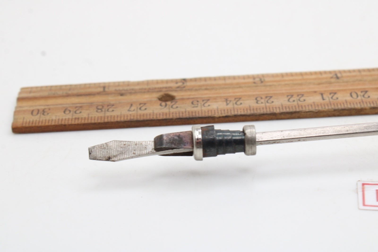 Great Neck Hard Amber/Black Handle Holding Slotted Flat Screwdriver