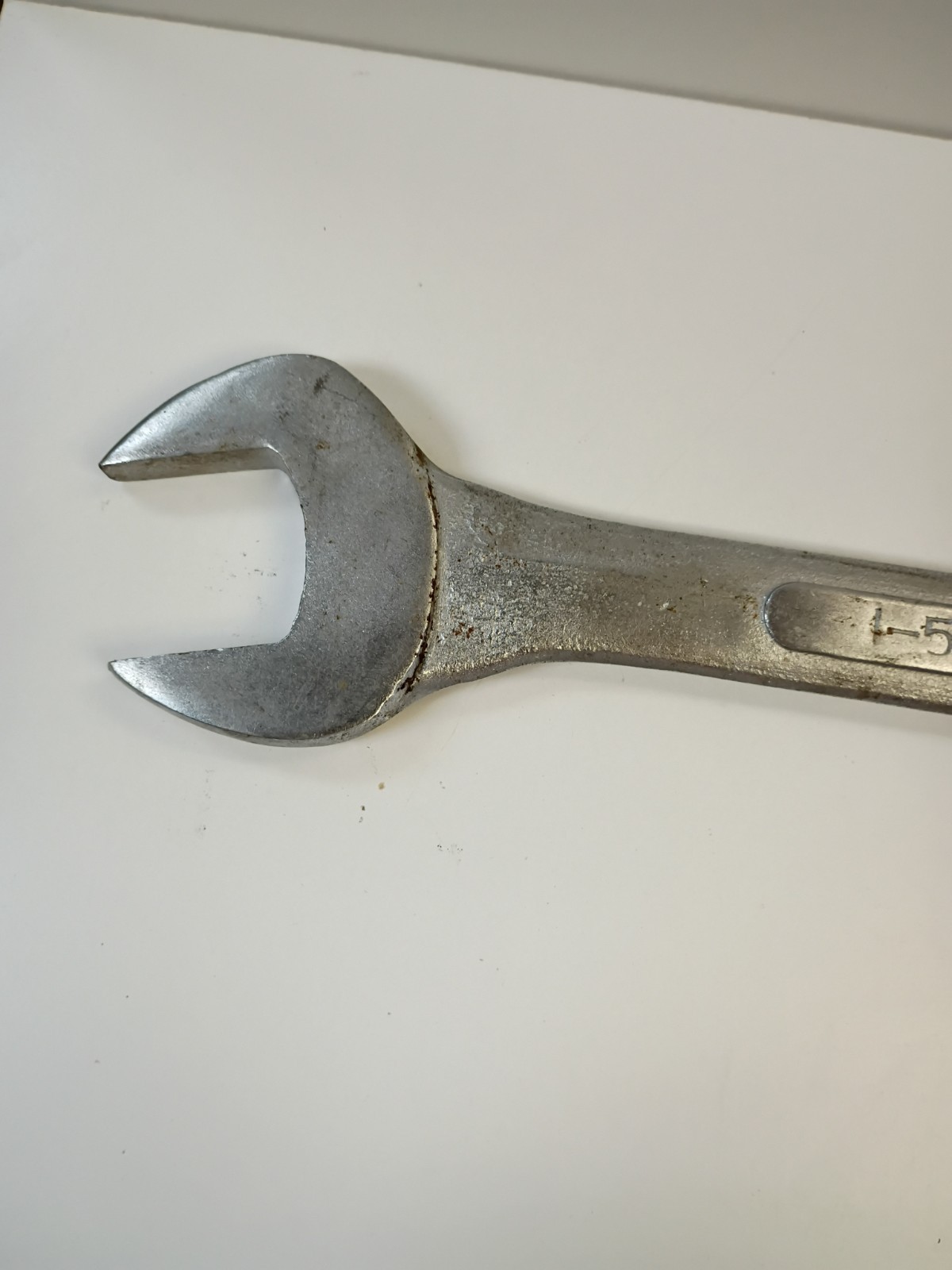 1 5/8-inch combination wrench featuring an open end and a 12-point box end