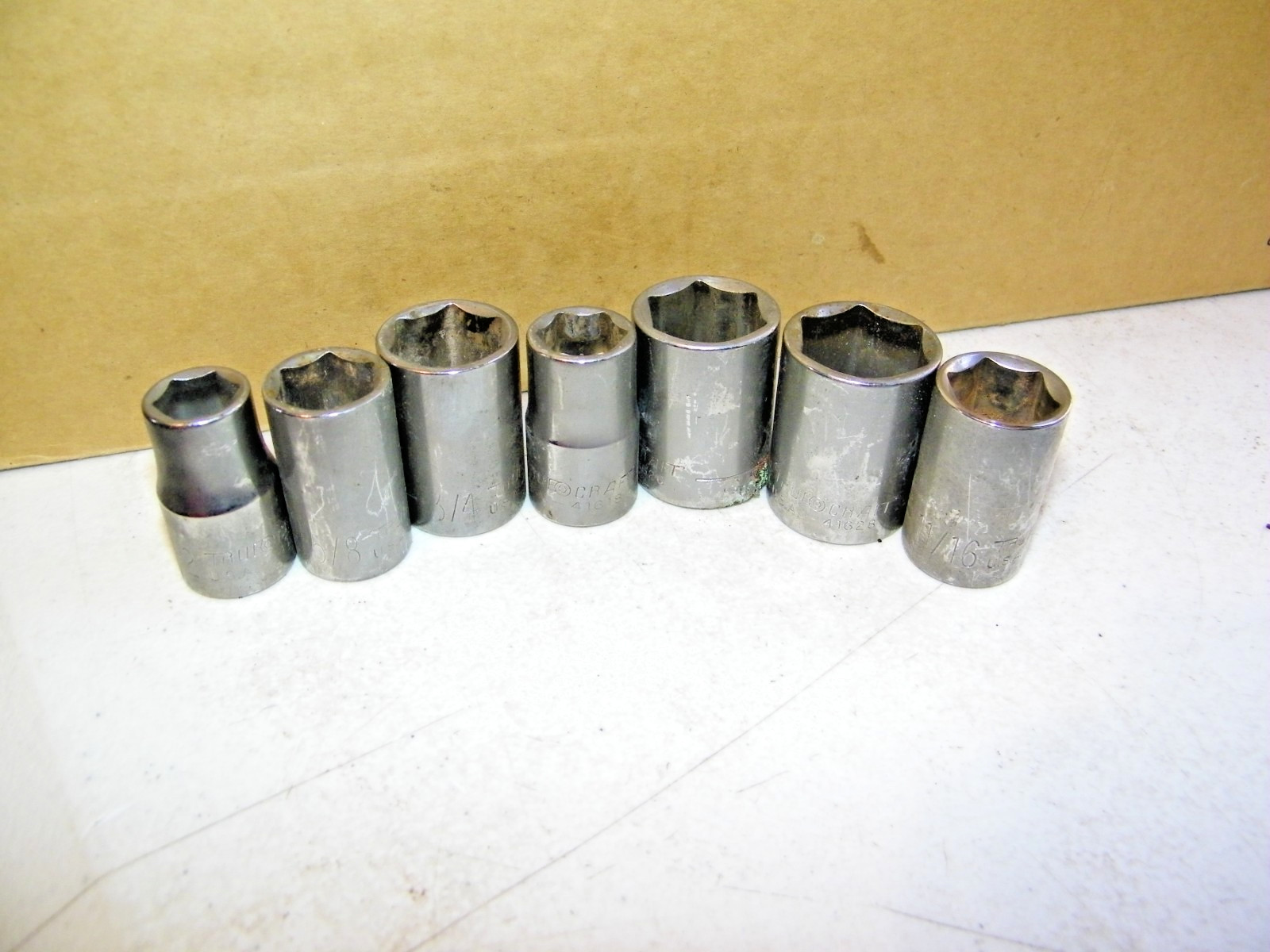 Lot Of 7 Truecraft Dr., 6 point Sockets 7/8, 13/16, 11/16, 3/4, 5/8,1/2, 9/16.