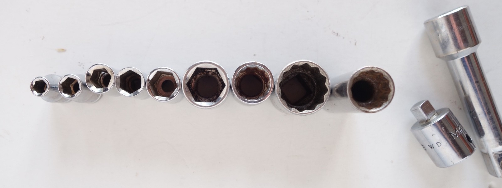 Lot of 11 pieces Sockets SAE and Metric, Extension, and Drive Adapter.