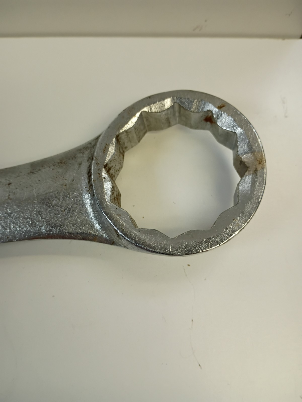 1 3/4-inch combination wrench featuring an open end and a 12-point box end