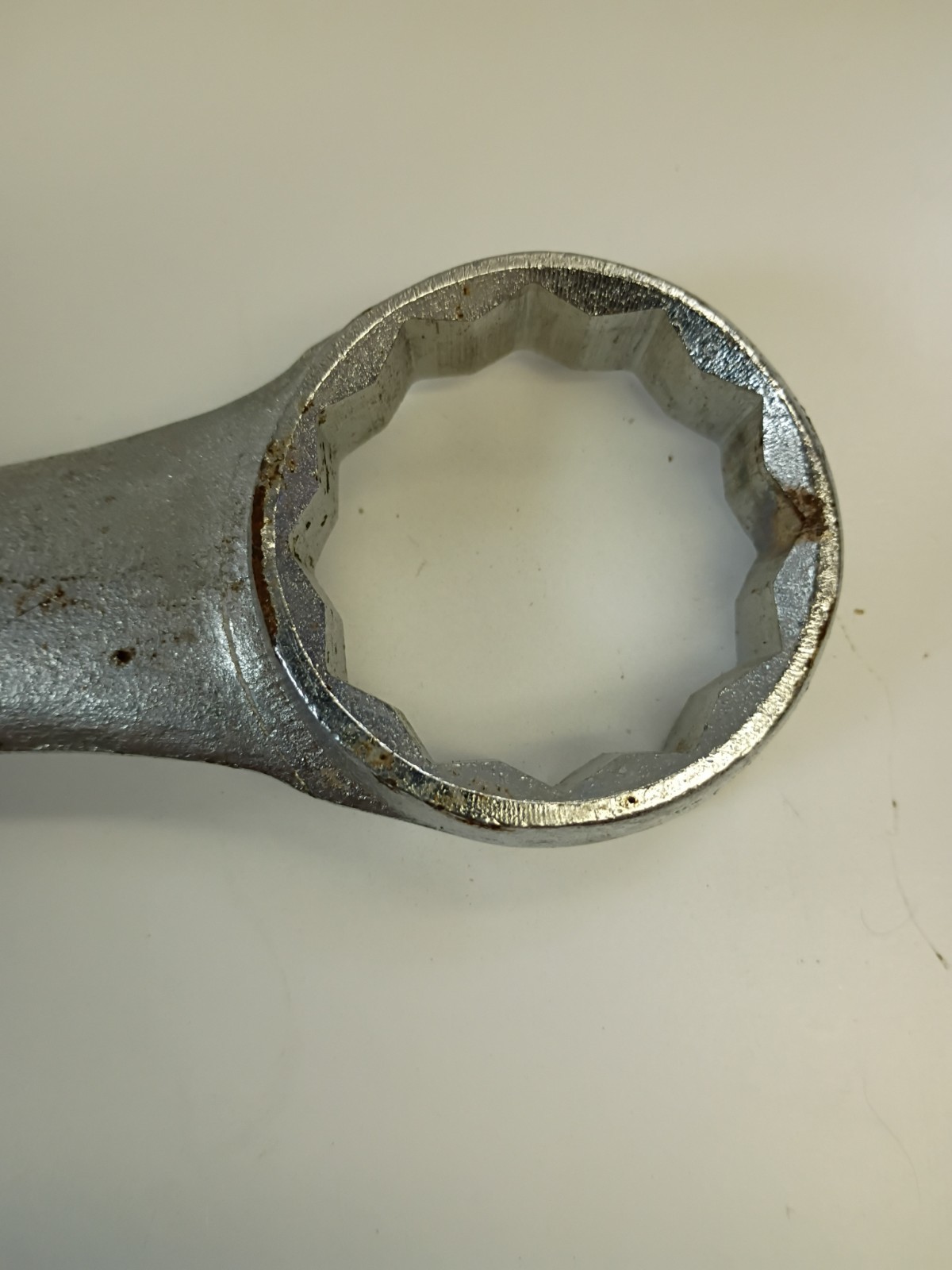 1 5/8-inch combination wrench featuring an open end and a 12-point box end