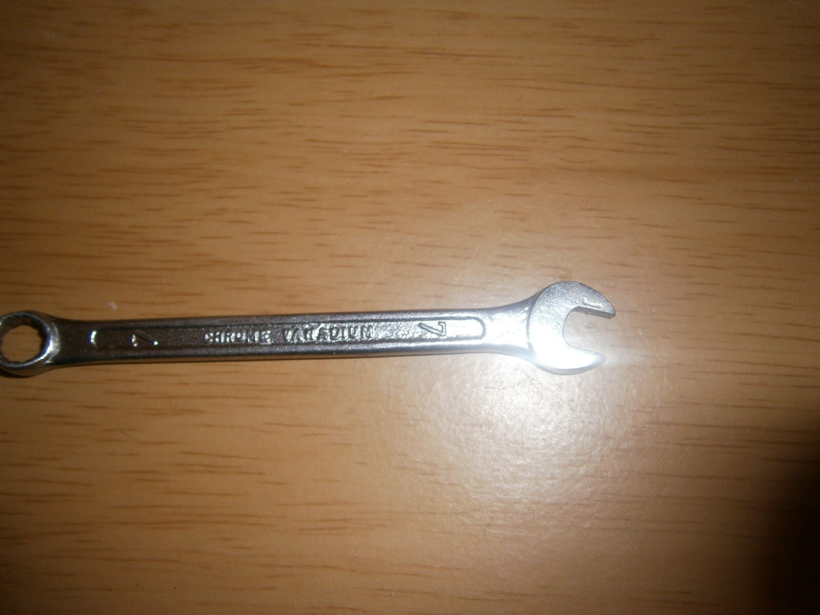 Vintage silver tone spanner. 7mm both ends.(E6c)
