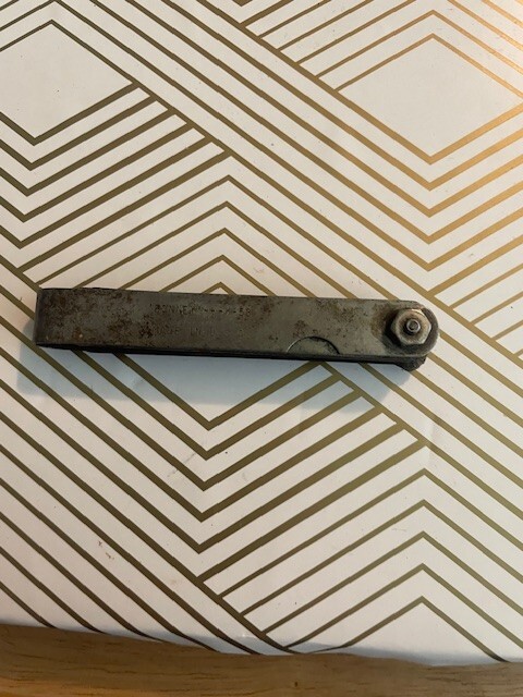 Vintage LS Starrett and Bonney feeler gauges; and a screw pitch thread gauge