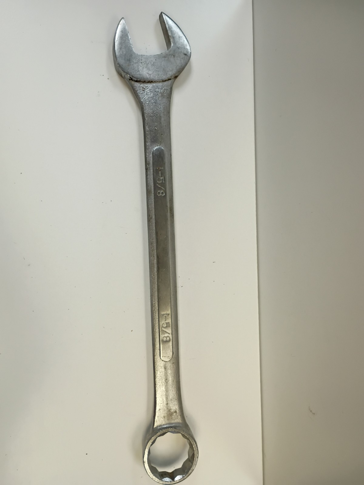 1 5/8-inch combination wrench featuring an open end and a 12-point box end