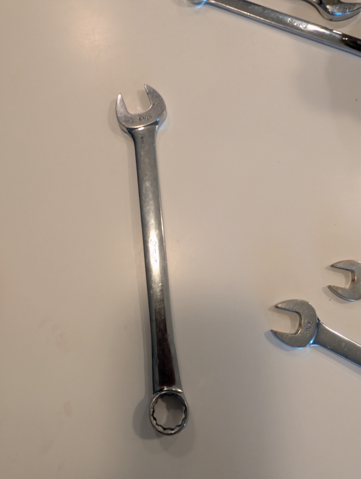 five snap-on wrenches. Four open end one swivel head. Decently well maintained