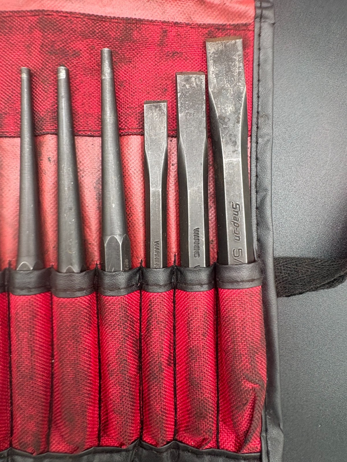 snap on 11pc punch and chisel set in soft roll case (some wear)