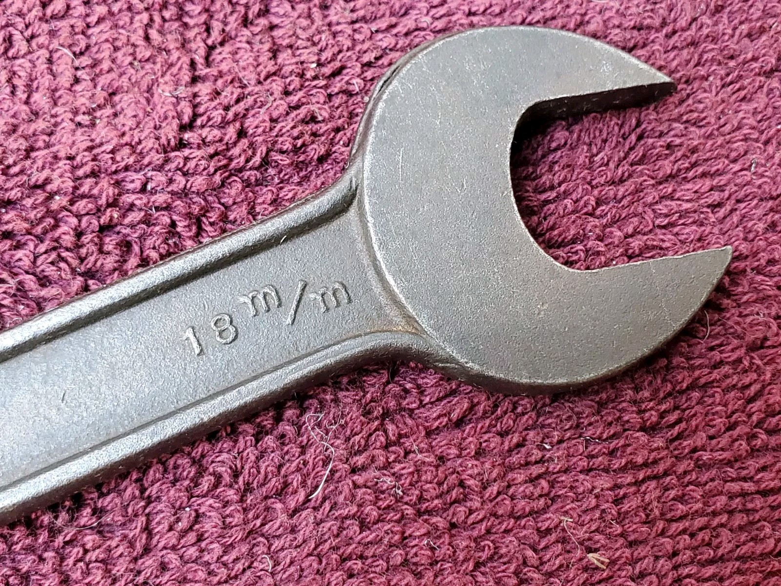 Unmarked 11/16″ by 19/32″ or 15 mm by 18 mm Open End Wrench
