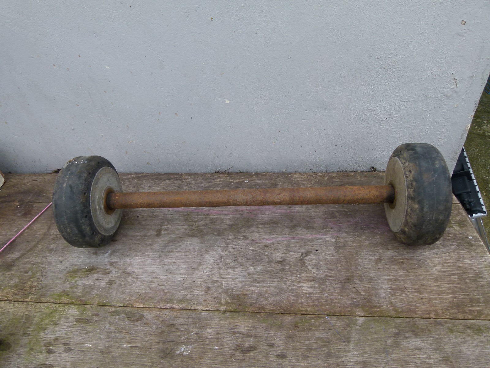 VINTAGE SOLID RUBBER WHEELS AXLES ARE 18 AND 15 INCH INSIDE WHEELS ARE 6 INCH