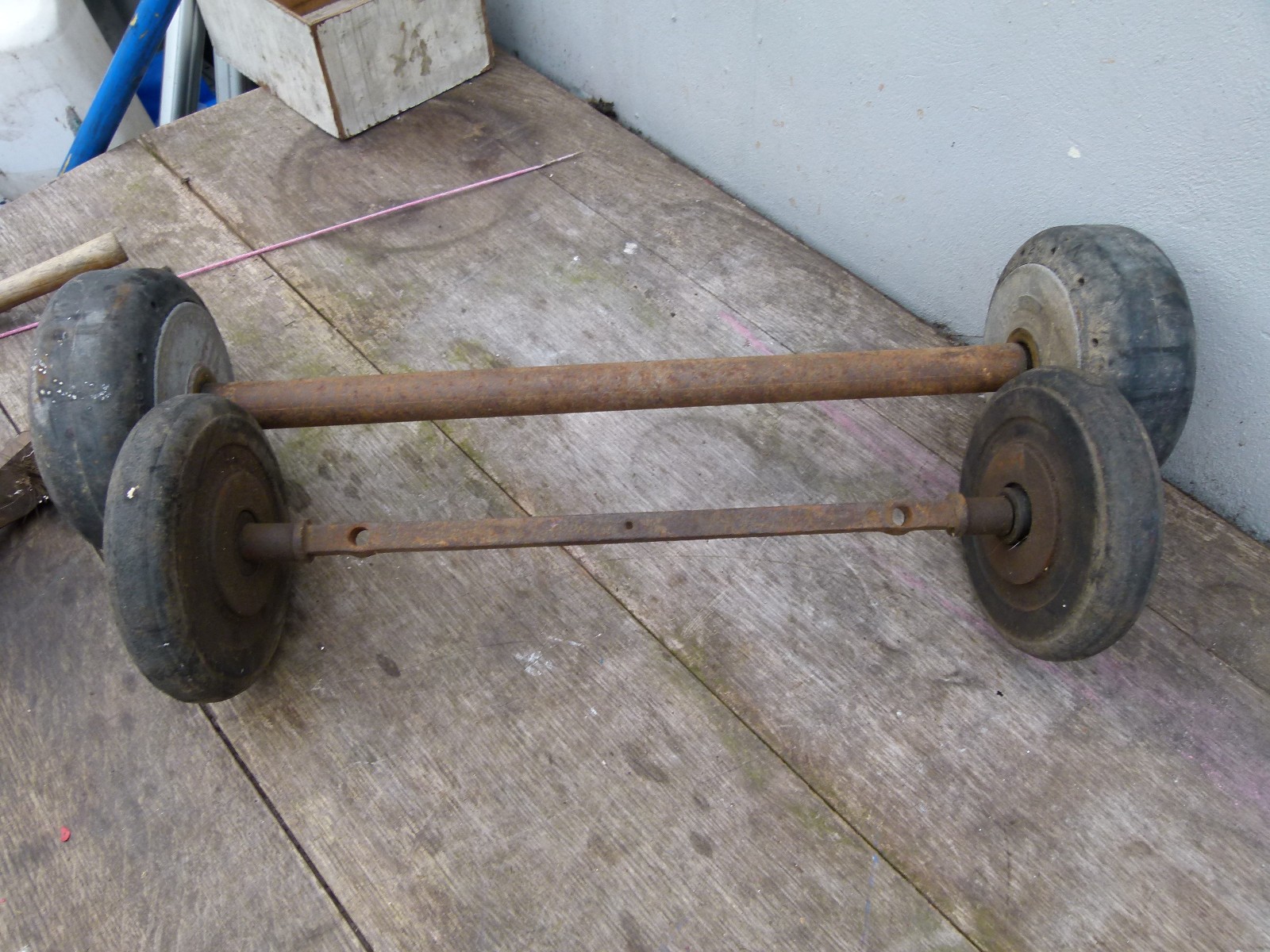 VINTAGE SOLID RUBBER WHEELS AXLES ARE 18 AND 15 INCH INSIDE WHEELS ARE 6 INCH
