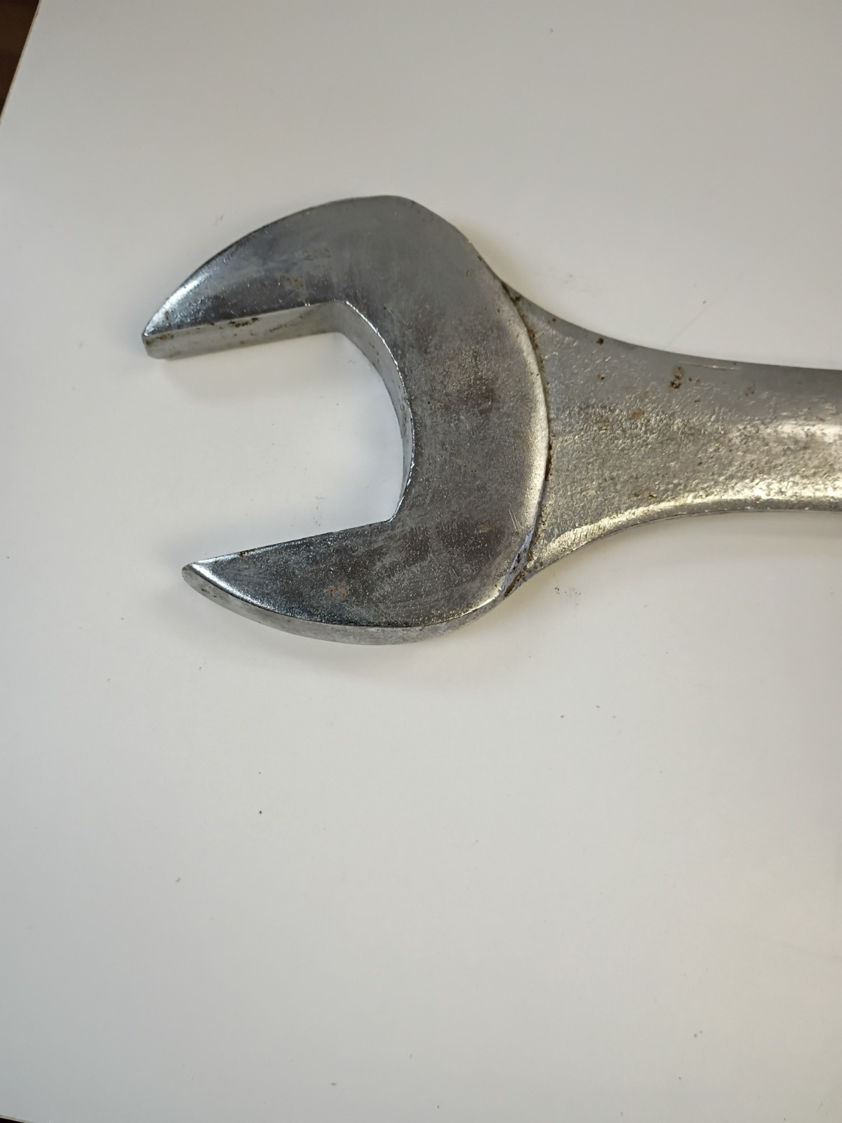 1 3/4-inch combination wrench featuring an open end and a 12-point box end