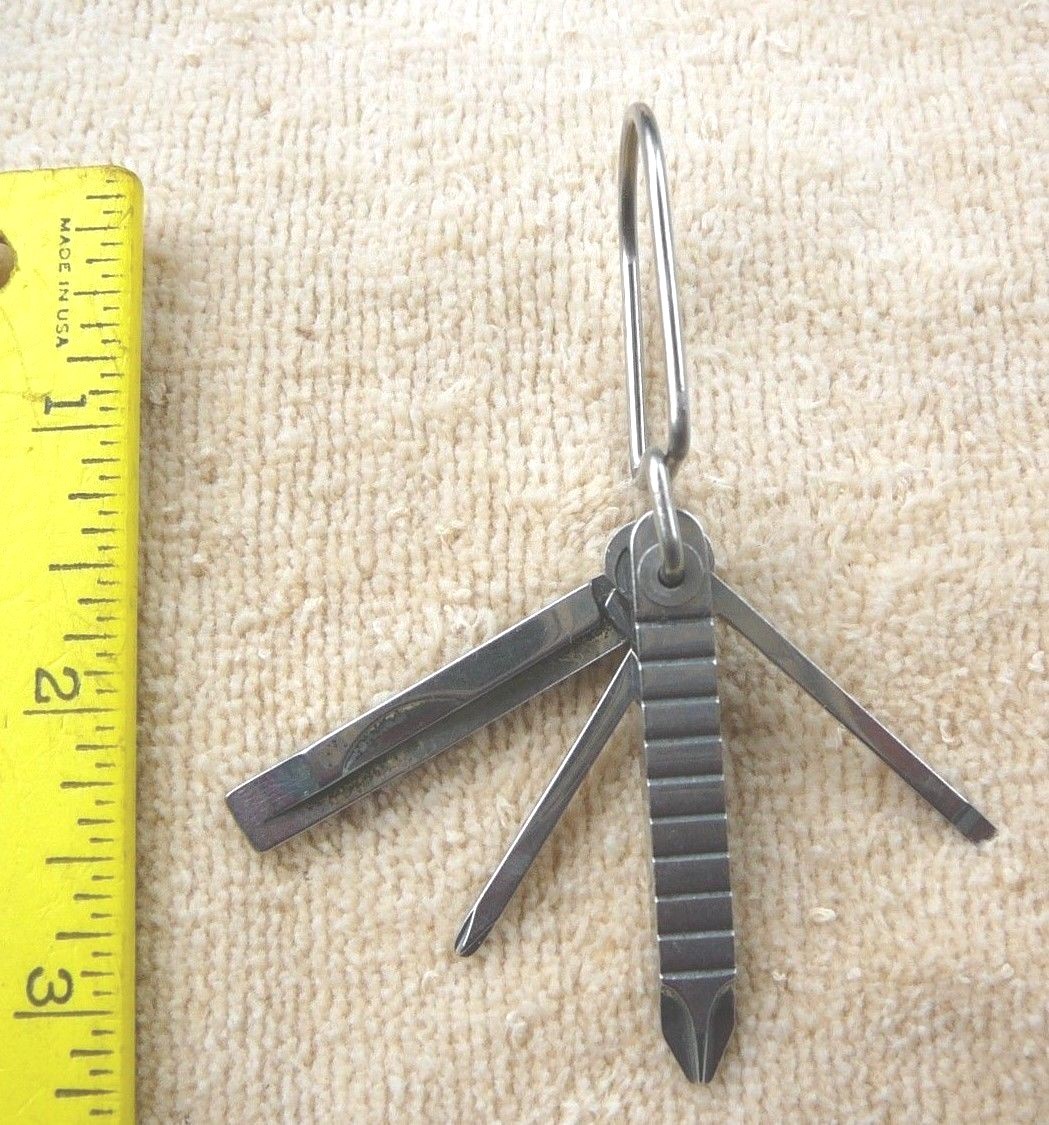 Pocket size screw drivers on a ring four heads New