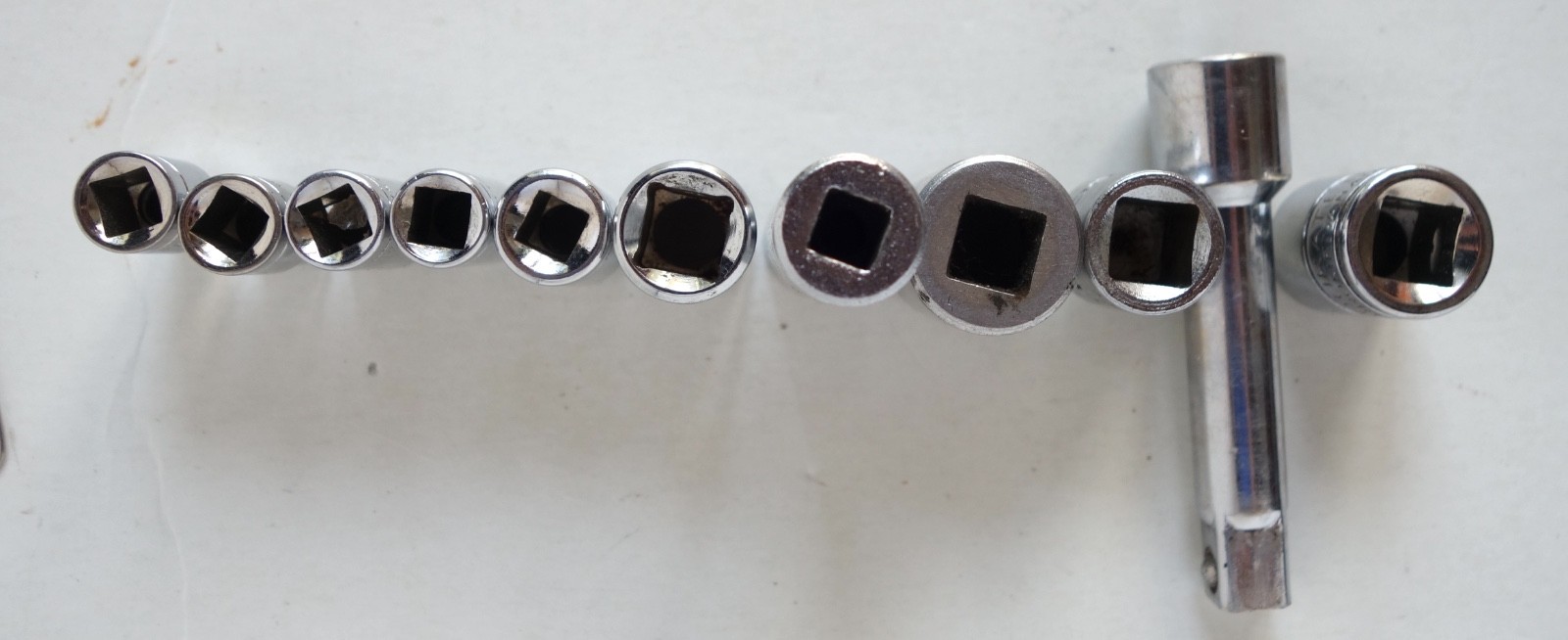Lot of 11 pieces Sockets SAE and Metric, Extension, and Drive Adapter.