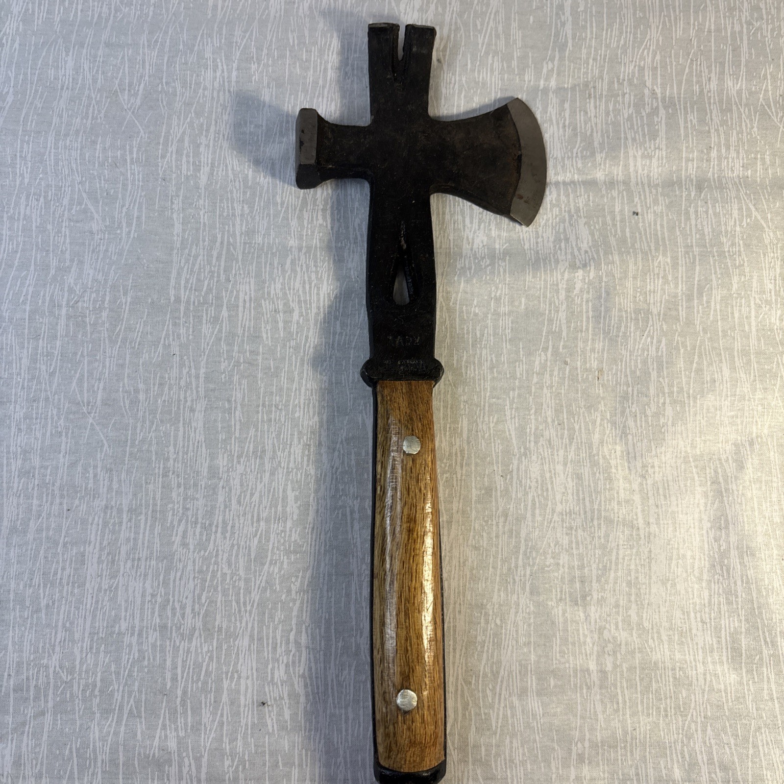 Hammer, Axe, Pry Bar With Black Blade And A Glossy Wooden Handle.