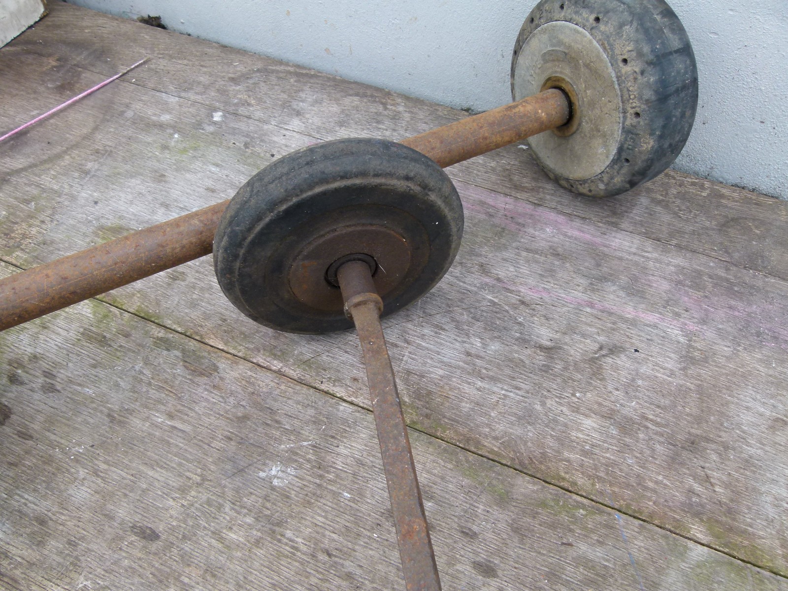 VINTAGE SOLID RUBBER WHEELS AXLES ARE 18 AND 15 INCH INSIDE WHEELS ARE 6 INCH